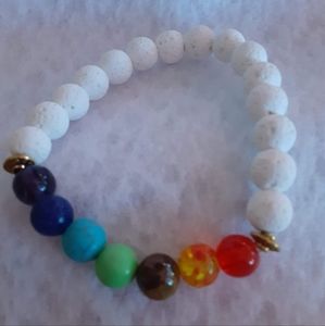 White lava stone beads and charkra colored bead bracelet.